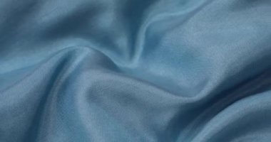 Teal kumaş arka planı. Teal bezi arka plan dokusunu dalgalandırır. Teal kumaş kumaş tekstil malzemesi.