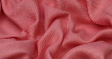 Pink fabric background. Pink cloth waves background texture. Pink fabric cloth textile material.