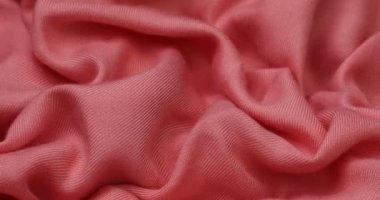 Pink fabric background. Pink cloth waves background texture. Pink fabric cloth textile material.