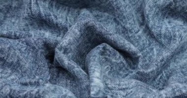 Blue fabric background. Blue cloth waves background texture. Blue fabric cloth textile material.