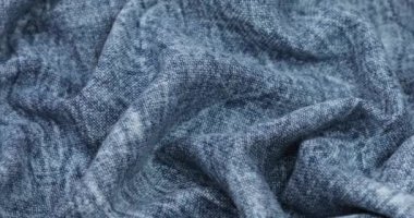 Blue fabric background. Blue cloth waves background texture. Blue fabric cloth textile material.