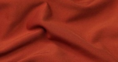 Turuncu kumaş arka plan. Turuncu bez dalgaları arka plan dokusu. Turuncu kumaş kumaş kumaş..
