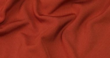 Turuncu kumaş arka plan. Turuncu bez dalgaları arka plan dokusu. Turuncu kumaş kumaş kumaş..