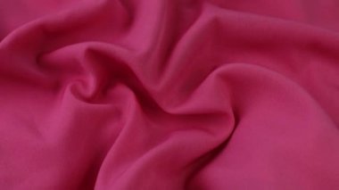 Pink fabric background. Pink cloth waves background texture. Pink fabric cloth textile material. 
