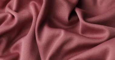 Pink fabric background. Pink cloth waves background texture. Pink fabric cloth textile material.