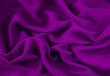 Mor kumaş arka plan. Mor kumaş dalgaları arka plan dokusu. Mor kumaş kumaş kumaş kumaş..