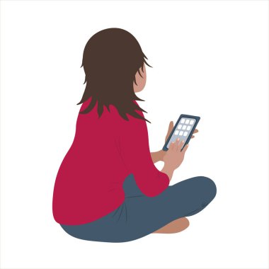 Elinde tabletle beyaz bir arka planda duran bir kız.