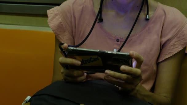 Woman Using Smartphone Playing Game Train Station — Stock Video