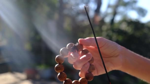 Woman Hand Taoist Buddhist Rosary Incense Sun Rays Natural Environment — Stock Video