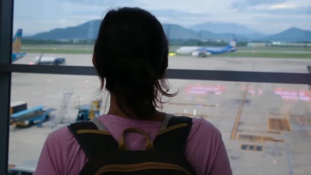 Solo Traveler Waits Her Suitcase Airport Window Gazing Planes — Stock Video