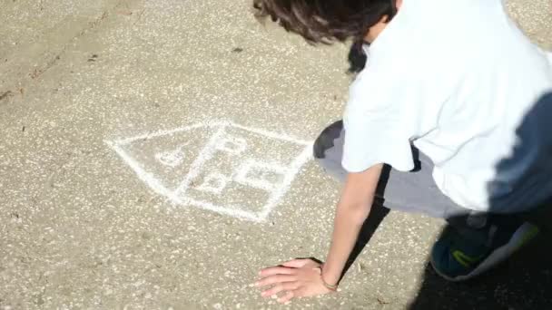 Young Child Drawing Sidewalk Chalk — Stock Video