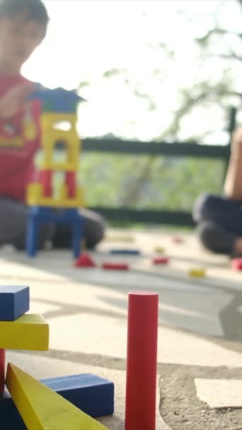 Boys Playing Plastic Blocks — Stock Video