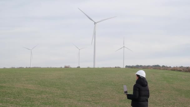 Woman Engineer Laptop Computer Working Countryside Wind Turbines — Stock video