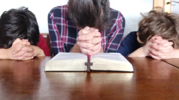 Young Mother Her Sons Praying Bible Crucifix — Stock Video