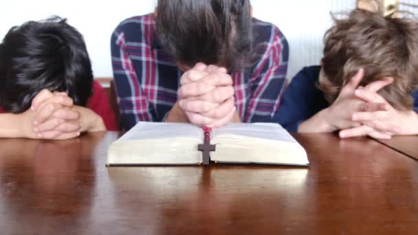 Young Mother Her Sons Praying Bible Crucifix — Stock Video