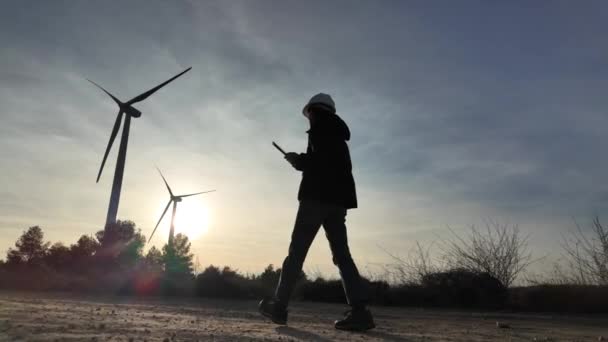 Young Woman Engineer Tablet Computer Checking Wind Turbines — 图库视频影像