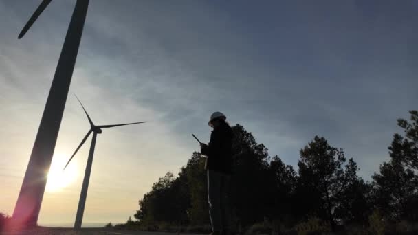 Young Woman Engineer Tablet Computer Working Countryside Wind Turbines Sunset — Vídeo de Stock
