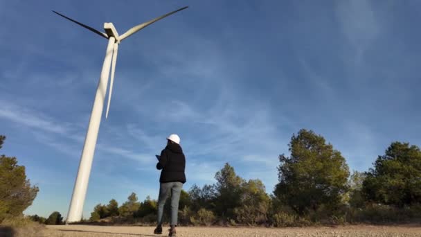 Woman Engineer Tablet Computer Working Countryside Wind Turbines — стоковое видео