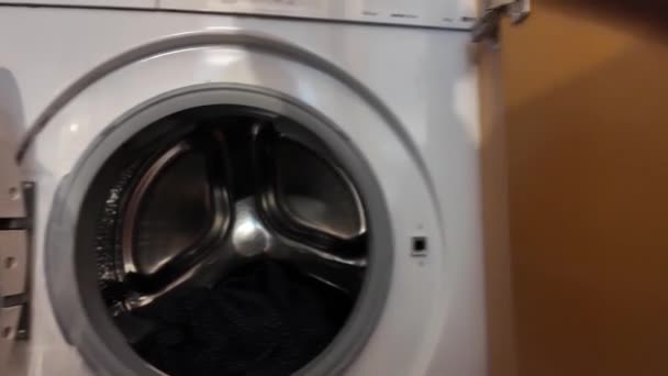 Man Putting Laundry Washing Machine — Stock Video