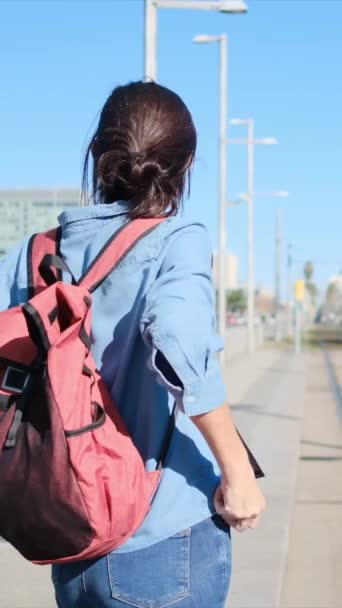 Young Woman Backpack Waits Tram Urban Train Platform Ready Embark — Stock Video