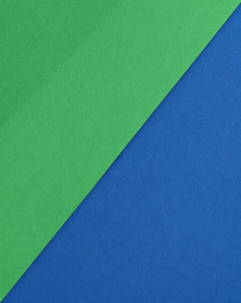 Geometric Background with Blue and Green Paper Texture in Quadrants