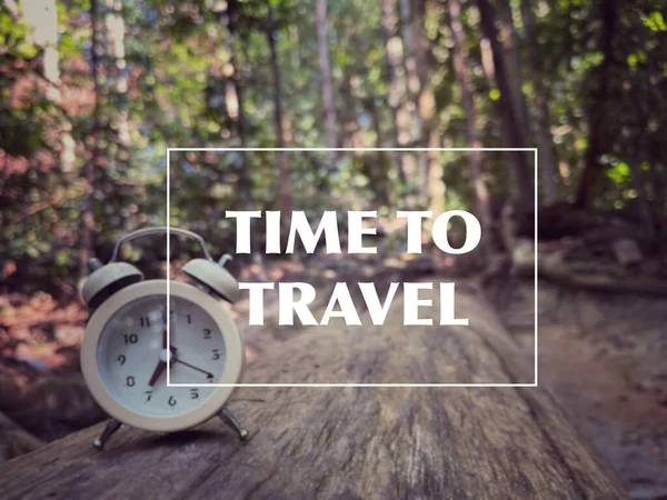 Motivational and inspirational wording. Time to travel. Written on blurred vintage styled background.