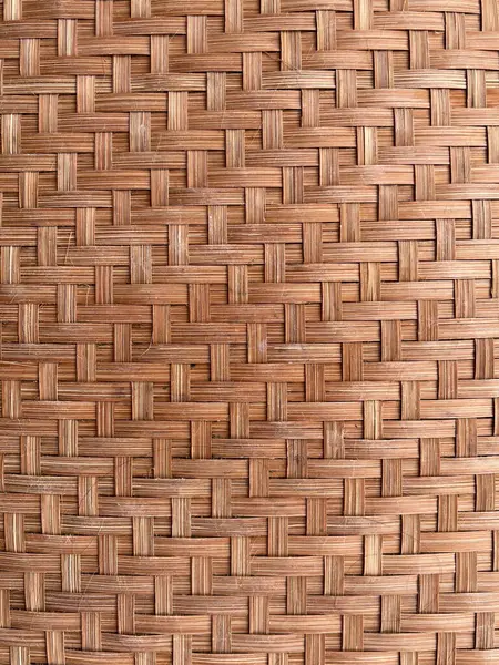 Background and texture concept. Close up of a basket tray texture made of woven bamboo skin. It showing unique design which are having utility as well as artistic value.