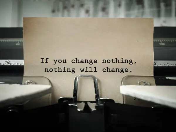 Motivational and inspirational wording. If You Change Nothing, Nothing Will Change written on a paper. With blurred style background.