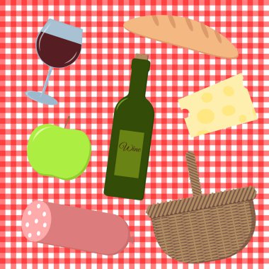 picnic food set on a checkered tablecloth