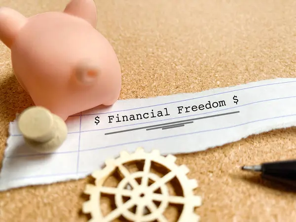 Financial freedom text on paper background. Stock photo.