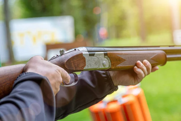 stock image Ukraine. Kyiv. September 22, 2022 .Skeet Shooting .Man shooting at target on an outdoor shooting range at sunny day, training alone, confident and skilled, experienced. Shooting and Guns. .