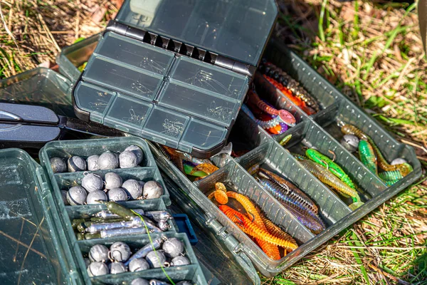 stock image Fishing tackles and fishing baits in box .Classic Colored Fishing Lure , Beautiful Background digital image.Fishing on the lake at sunset.