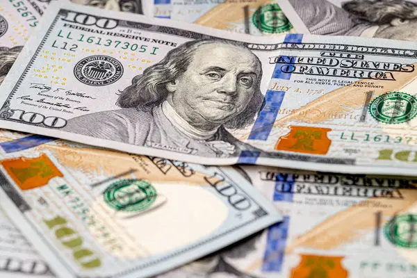 Money, US dollar bills background. Money scattered on the desk.