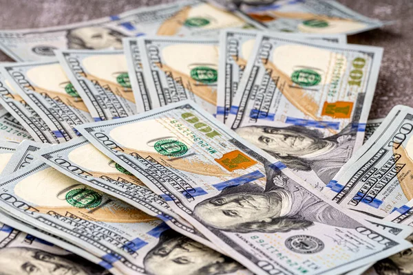 Money, US dollar bills background. Money scattered on the desk.