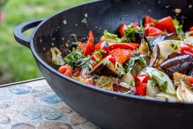 Grilled vegetable salad with zucchini, eggplant, onion, pepper and tomato