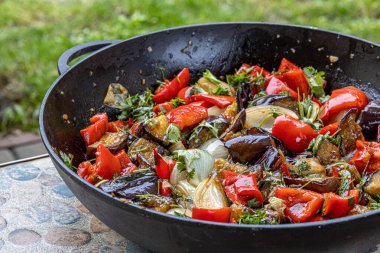 Grilled vegetable salad with zucchini, eggplant, onion, pepper and tomato