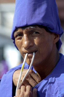 close-up of a nazareno man with a face of pain for his penance in a holy week procession. High quality photo clipart