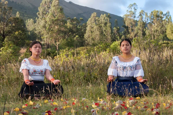 two sisters doing breathing exercises and seeking inner peace between body and mind. High quality photo
