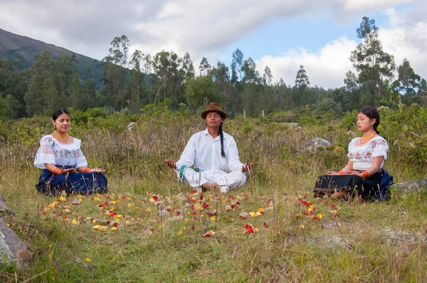 family from otavalo, ecuador in a retreat of peace and tranquility in a traditional ceremony of their culture in the mountains. High quality photo