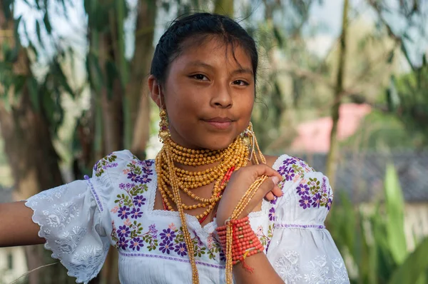 Cultural Pride: Self-Assured Ecuadorian Girl in Traditional Gold Adornments. High quality photo