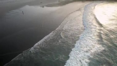 Paradise Beach With Sea Waves Washing On The Shore At Sunrise. Aerial Drone Shot