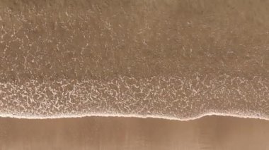 Above View Of Calm Waves Of Grande de Mio Beach In A Coruna, Spain. Aerial Shot