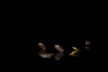 Polish money on black shiny table with dark reflection