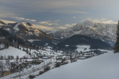 Winter evening over Spital am Pyhrn in Austria with railway small station