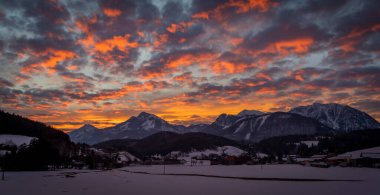 Winter morning with color clouds and big dark nice hills