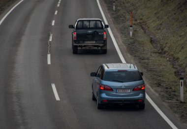 Fast road with cars in winter cold cloudy day without snow near Rohr im Kremstal 02 11 2023