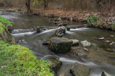 Dalejsky creek in Prokopske valley in winter dark cloudy day in capital Prague
