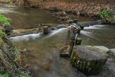Dalejsky creek in Prokopske valley in winter dark cloudy day in capital Prague