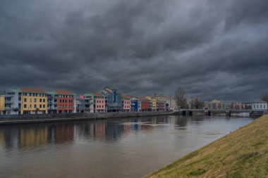 Modern houses with dark cloudy fresh sky in Pisek 02 18 2023