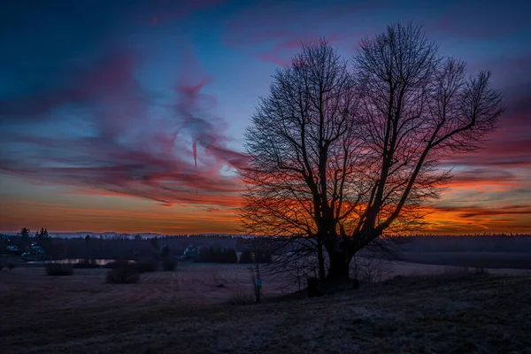 Fresh winter sunset with color sky near Andelska Hora village with old ruins and chapel